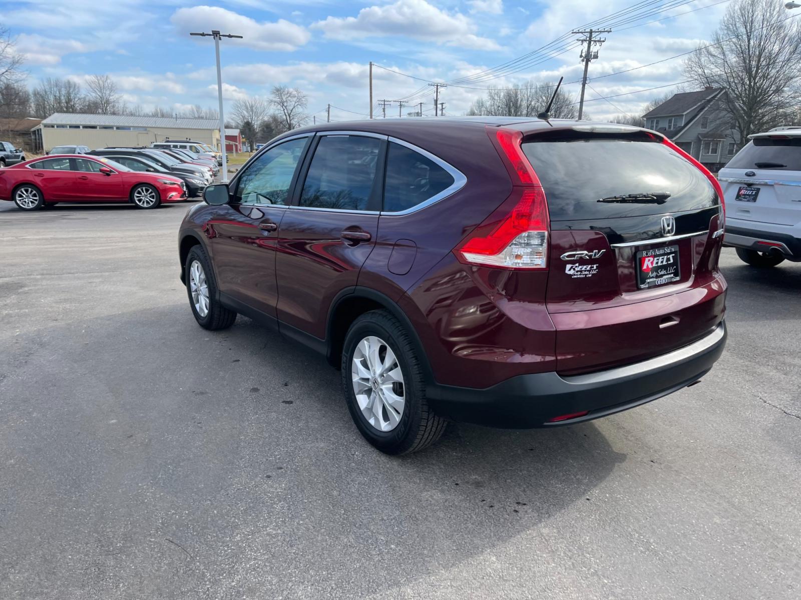2014 Red /Gray Honda CR-V EX 4WD 5-Speed AT (5J6RM4H59EL) with an 2.4L I4 DOHC 16V engine, 5-Speed Automatic transmission, located at 547 E. Main St., Orwell, OH, 44076, (440) 437-5893, 41.535435, -80.847855 - This 2014 Honda CR-V AWD EX with a 2.4L engine and 5-speed automatic transmission offers a balanced blend of comfort, reliability, and efficiency. Equipped with ECO mode, it optimizes fuel efficiency, making it a budget-friendly option for those conscious of fuel consumption. The addition of a backu - Photo #8
